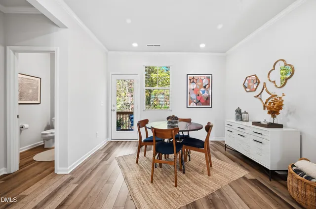 a view of a dining room with furniture and a window