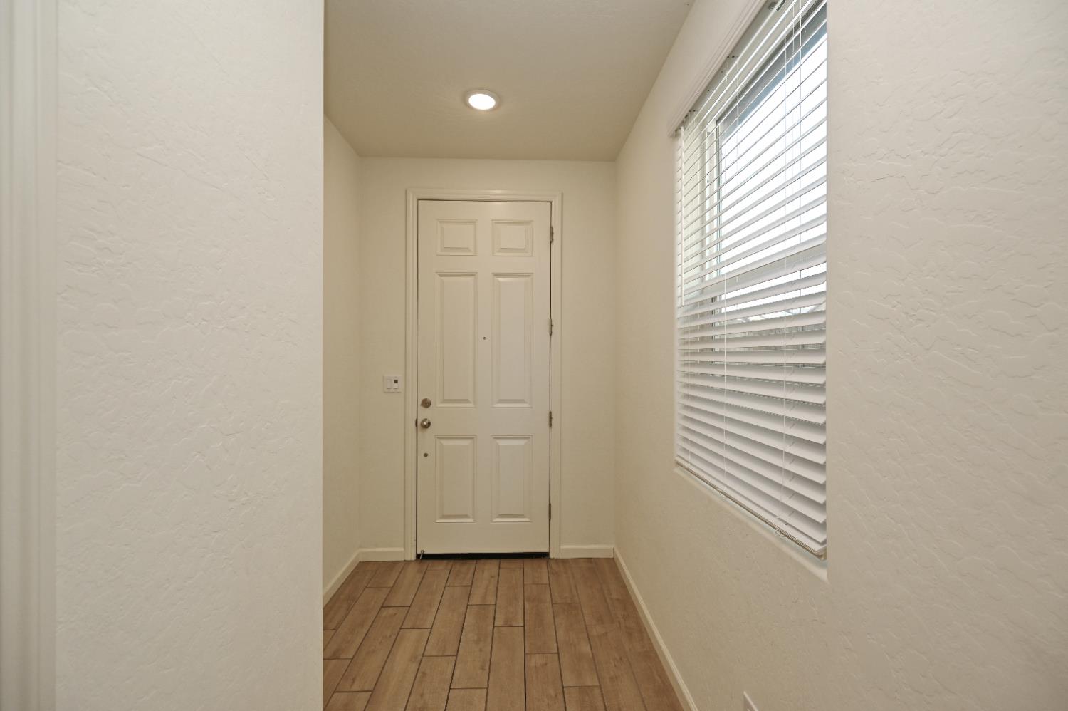 2273 North Raleigh Drive Fresno, CA 93727 - Photo 18 of 29 a view of a room with wooden floor and windows