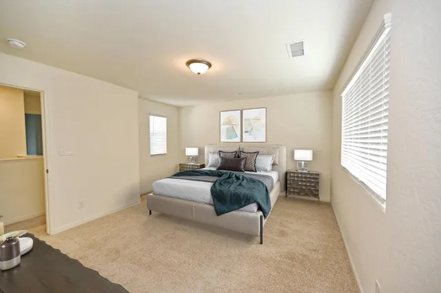 a bedroom with a bed and a cabinets