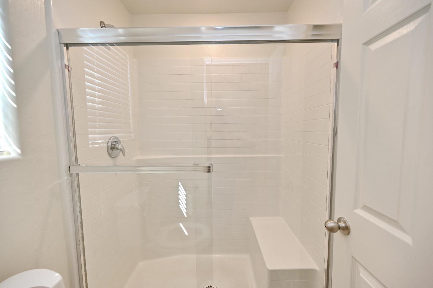 2273 North Raleigh Drive Fresno, CA 93727 - Photo 25 of 29 a bathroom with a shower