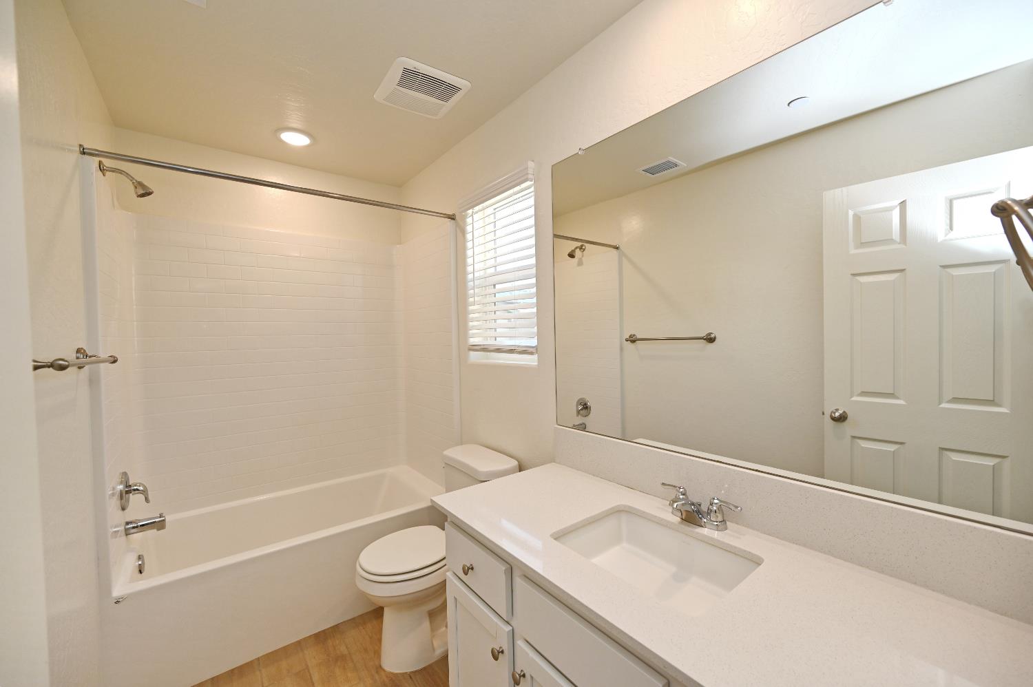 2273 North Raleigh Drive Fresno, CA 93727 - Photo 27 of 29 a bathroom with a sink a toilet and shower