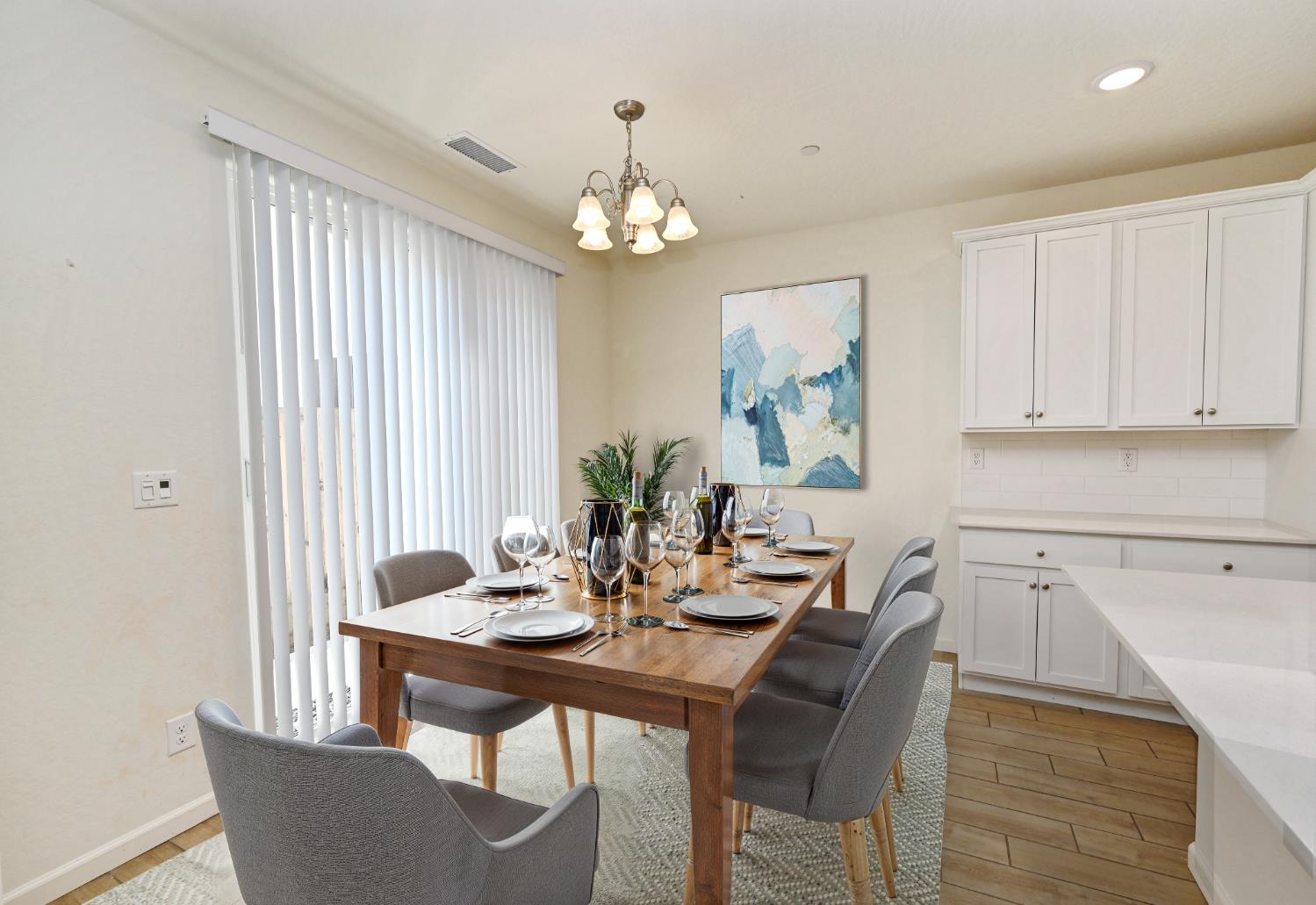 2273 North Raleigh Drive Fresno, CA 93727 - Photo 4 of 29 a view of a dining room with furniture and chandelier