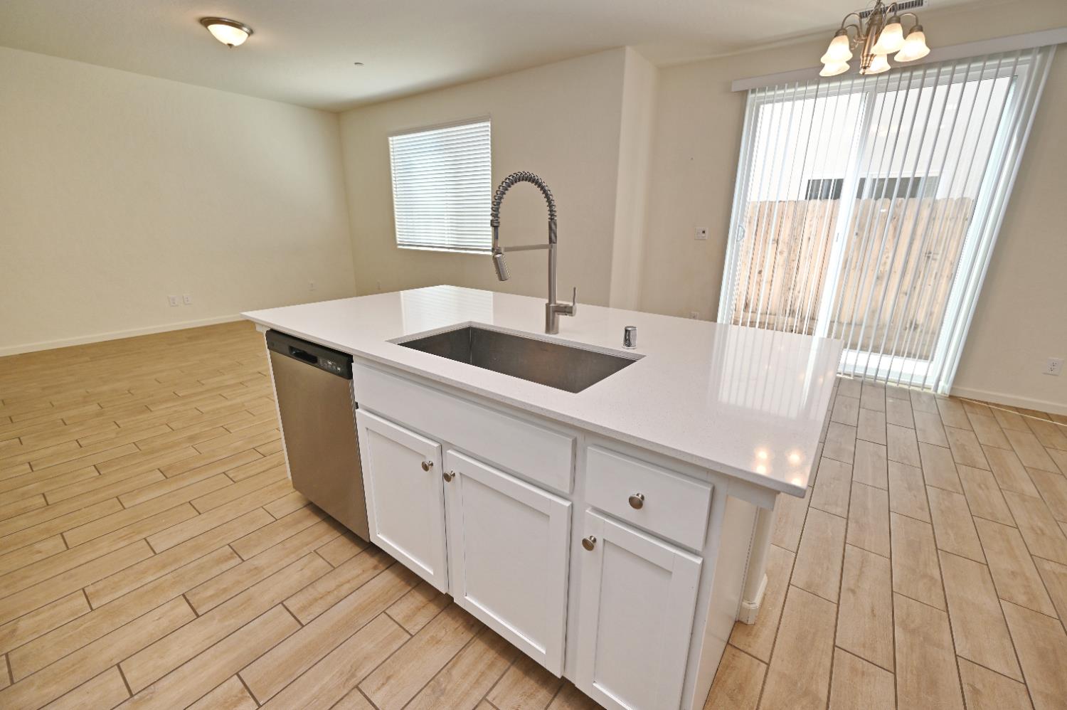 2273 North Raleigh Drive Fresno, CA 93727 - Photo 10 of 29 a kitchen with a sink and cabinets