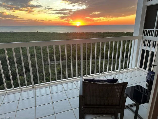 a view of a chairs and table in the roof deck