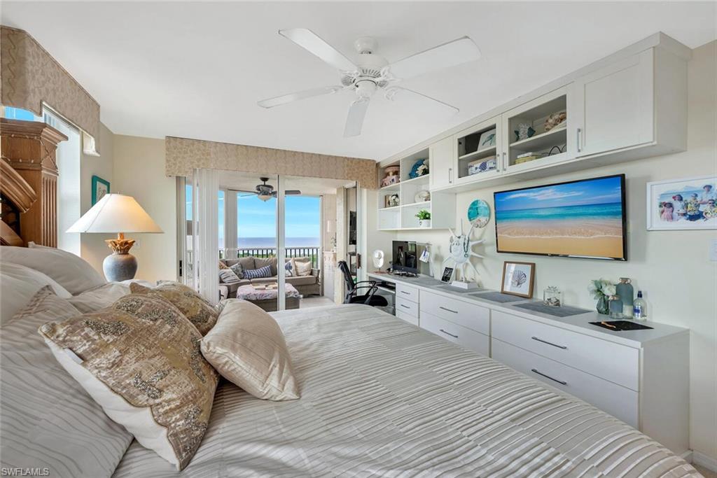 6573 Marissa Loop, Unit 1704 Naples, FL 34108 - Photo 12 of 39 a large bedroom with a large bed a flat tv screen and dresser