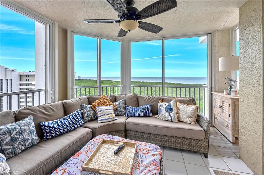 6573 Marissa Loop, Unit 1704 Naples, FL 34108 - Photo 16 of 39 a living room with furniture and a large window