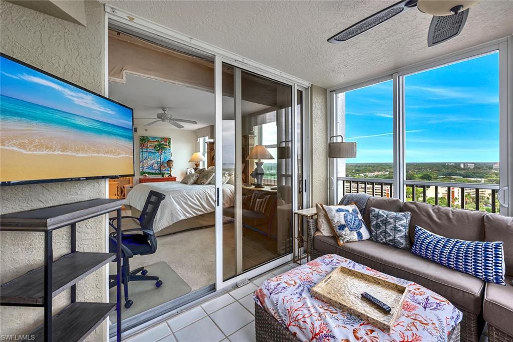 6573 Marissa Loop, Unit 1704 Naples, FL 34108 - Photo 17 of 39 a bedroom with furniture and a large window