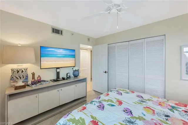 a bed room with a bed and a dresser