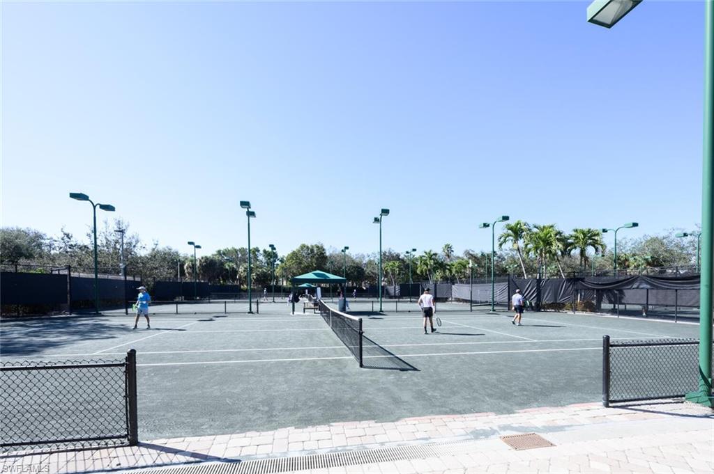 6573 Marissa Loop, Unit 1704 Naples, FL 34108 - Photo 33 of 39 a view of a park with sitting area
