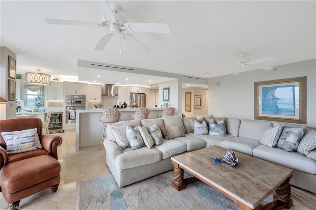 6573 Marissa Loop, Unit 1704 Naples, FL 34108 - Photo 5 of 39 a living room with furniture kitchen view and a table