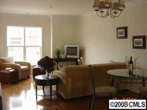 4136 Walker Road, Unit 4136 Charlotte, NC 28211 - Photo 3 of 8 a living room with furniture and a flat screen tv