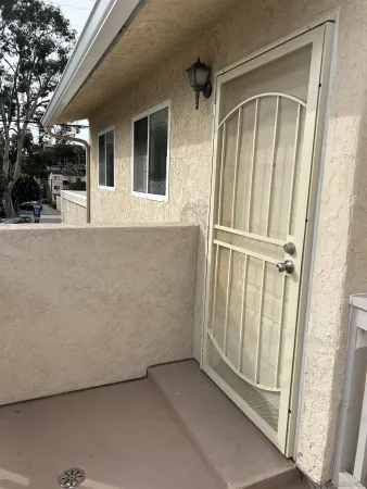 a view of a house with a wooden door