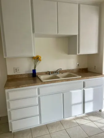 a kitchen with cabinets and appliances