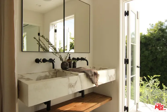 a bathroom with a sink and a mirror