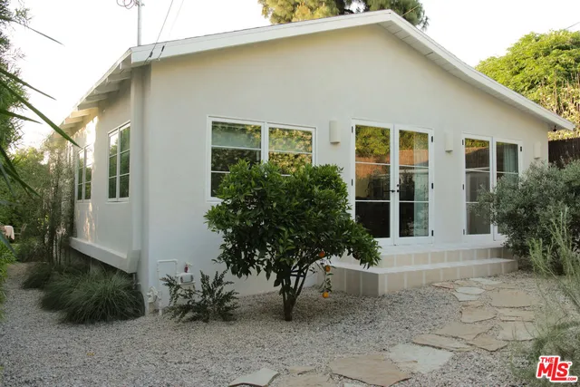a dining room with furniture and a chandelier