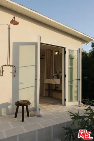 a pathway of a house with a yard