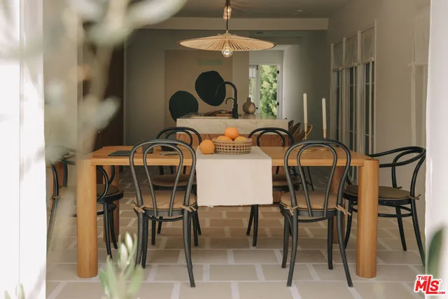 a living room with couches and painted walls