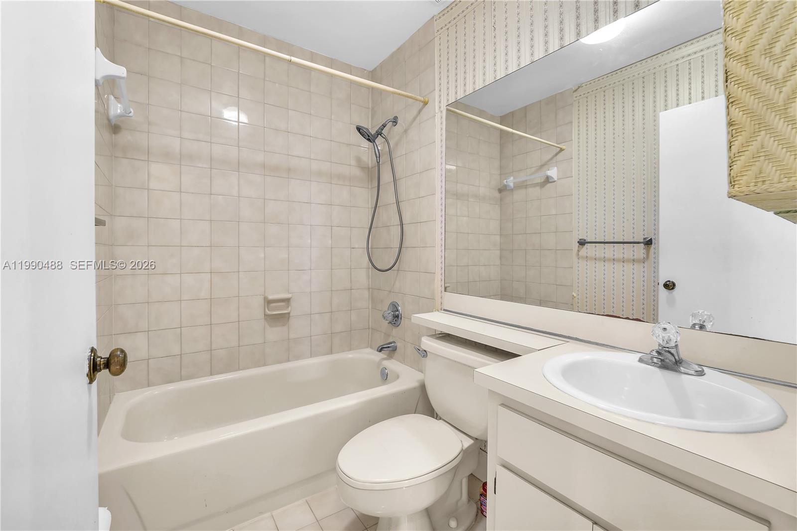 6671 Southwest 137th Court, Unit 7A Miami, FL 33183 - Photo 12 of 13 a bathroom with a sink toilet and shower