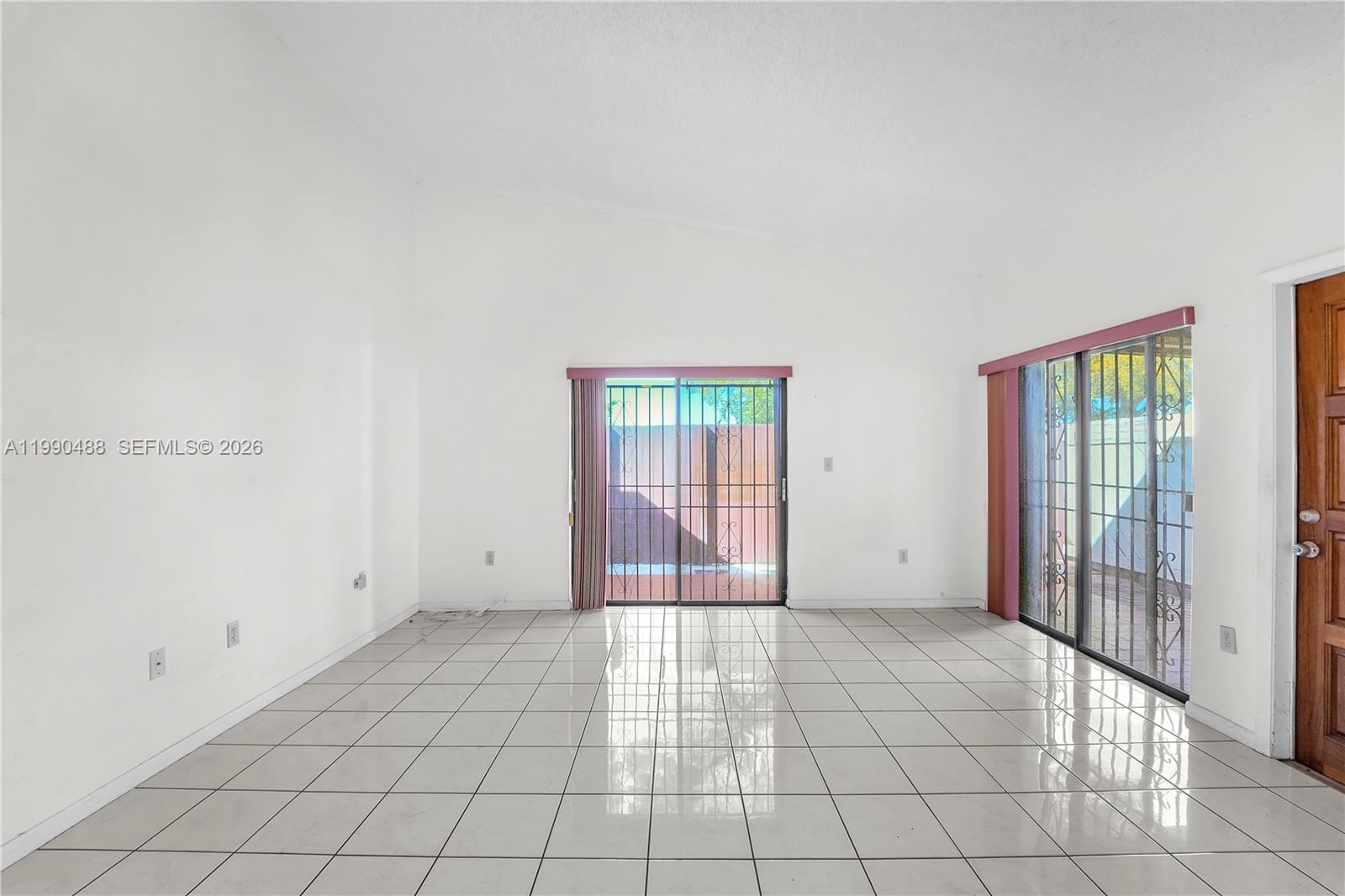 6671 Southwest 137th Court, Unit 7A Miami, FL 33183 - Photo 5 of 13 a view of an empty room with window