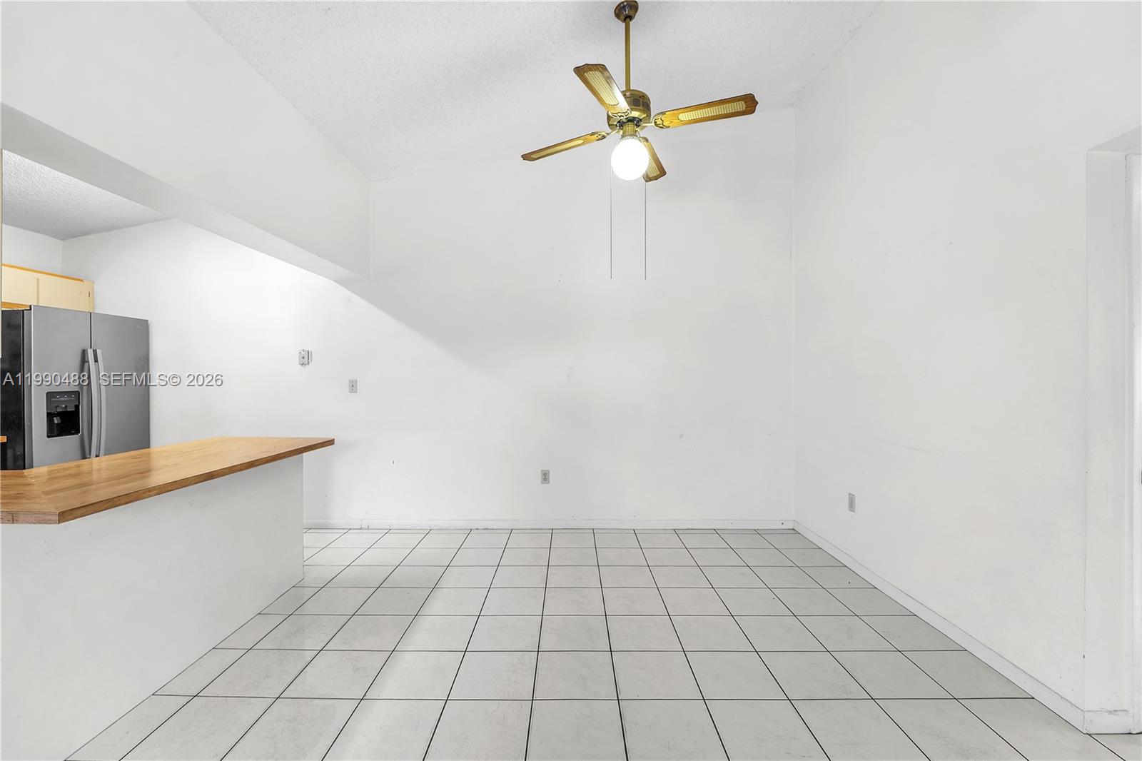 6671 Southwest 137th Court, Unit 7A Miami, FL 33183 - Photo 7 of 13 an empty room with white walls and white walls