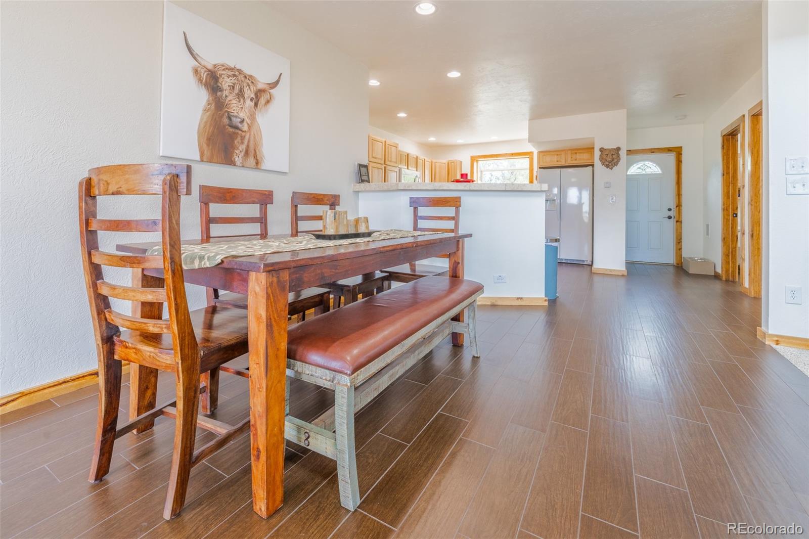 8221 Remington Road Como, CO 80432 - Photo 16 of 49 a view of a dining room with furniture and wooden floor