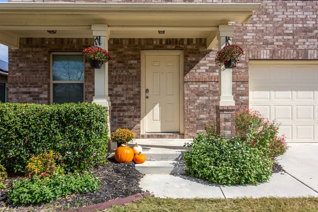 front view of a house with a small yard