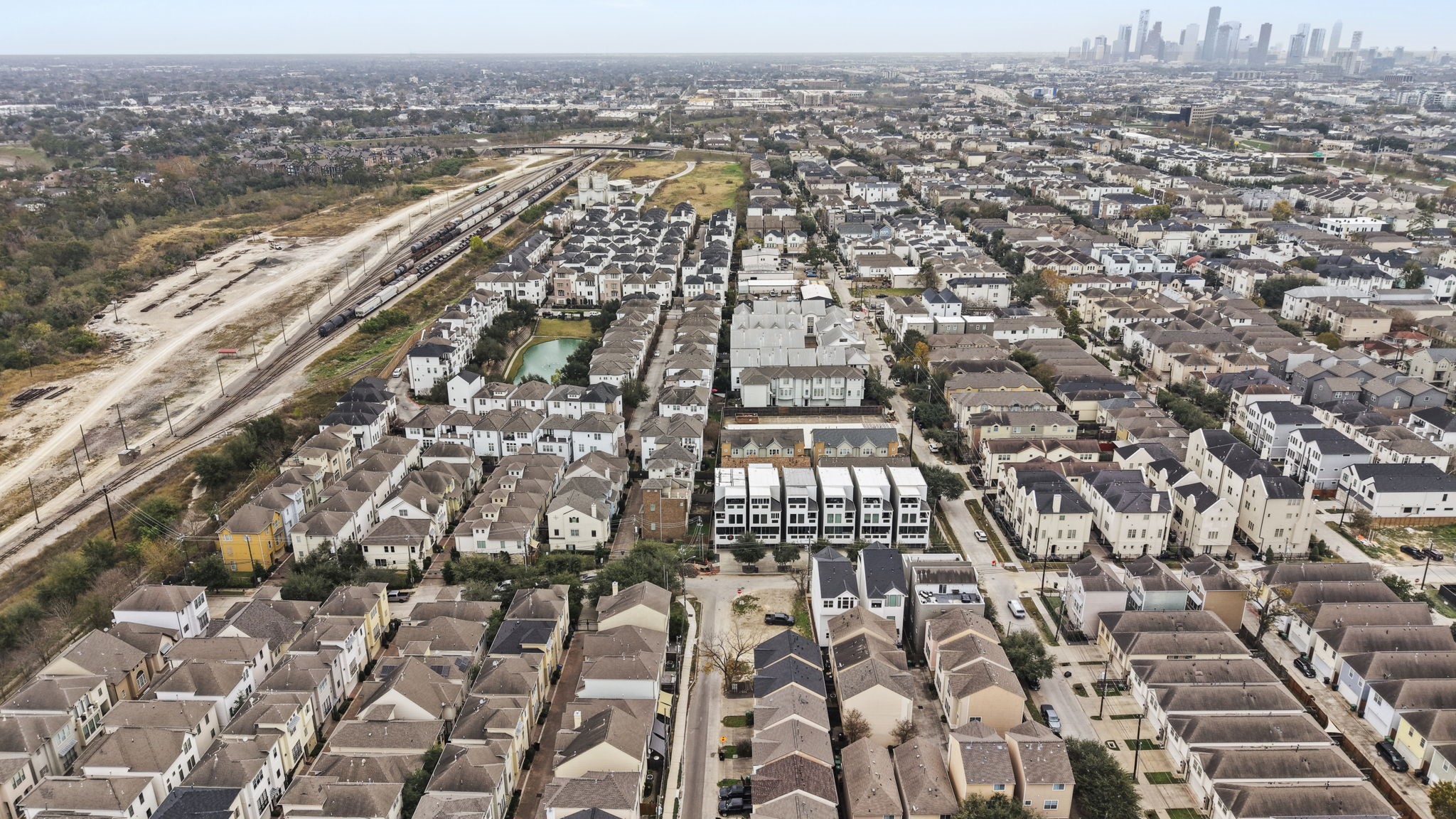 5807 Katy Street Houston, TX 77007 - Photo 28 of 37 See the bigger picture. This wide aerial highlights the property’s easy access to major thoroughfares, local commerce, and the surrounding residential boom. It’s not just a lot; it’s a strategic asset.