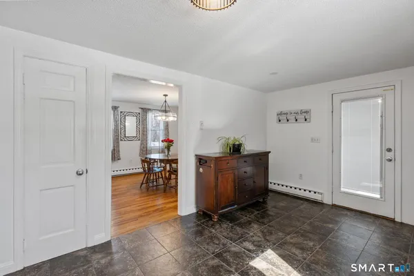 a view of kitchen with furniture and wooden floor