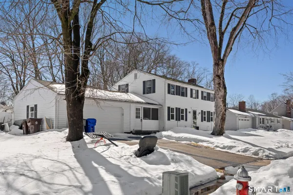 a view of a house with snow on the background
