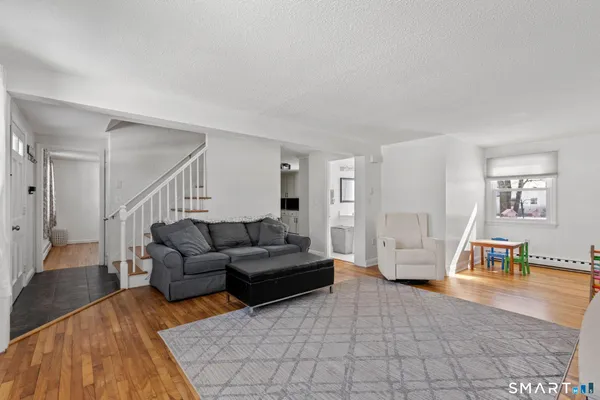 a living room with furniture and a table