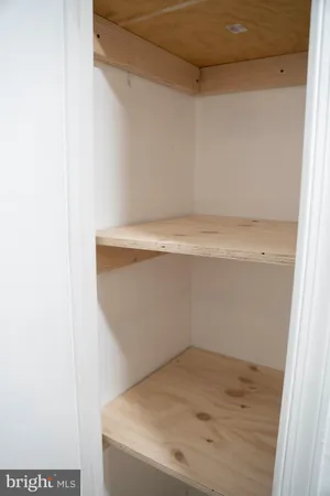 a close up of a refrigerator a sink a stove and white cabinets