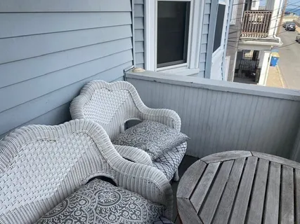a view of a balcony with furniture