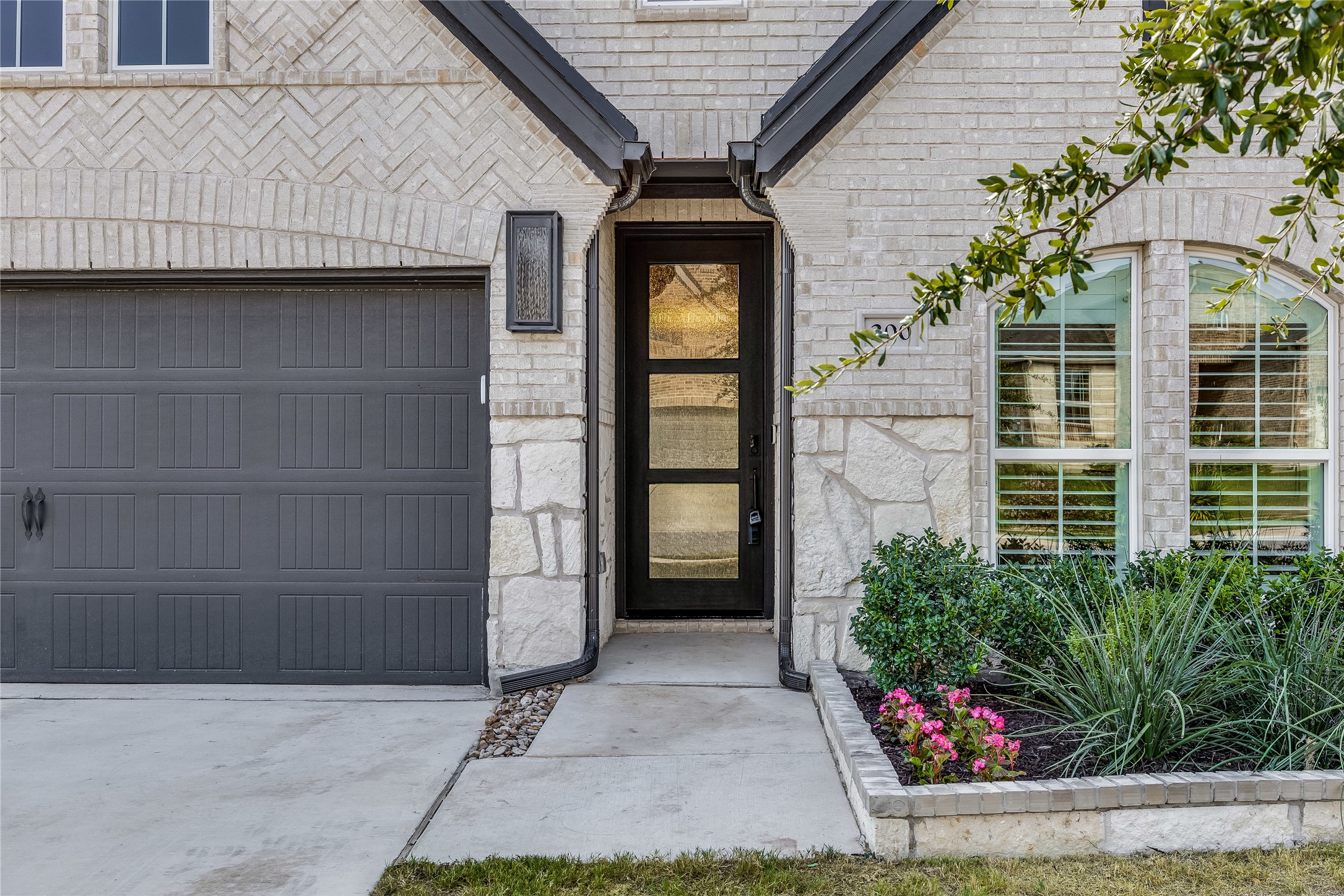 200 Grn Knl Lane Georgetown, TX 78628 - Photo 4 of 32 a front view of a house with a garage