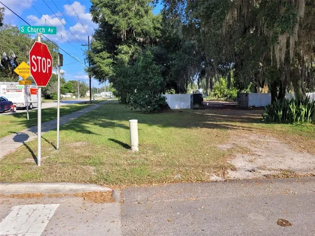 a view of a yard with a tree