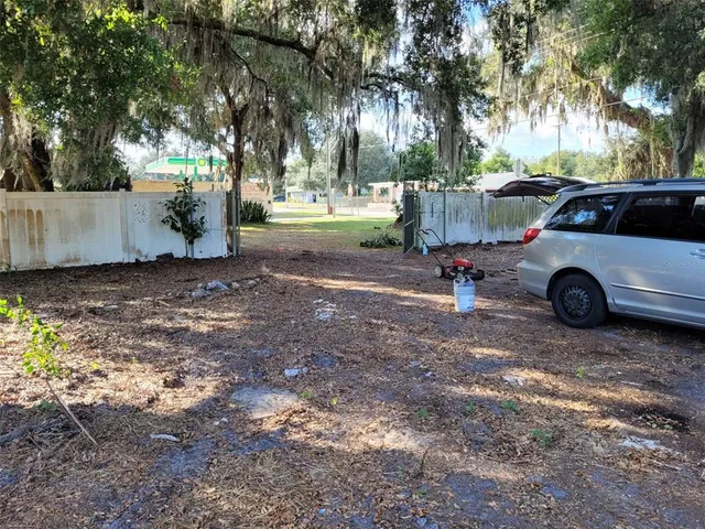 a view of street with parked cars