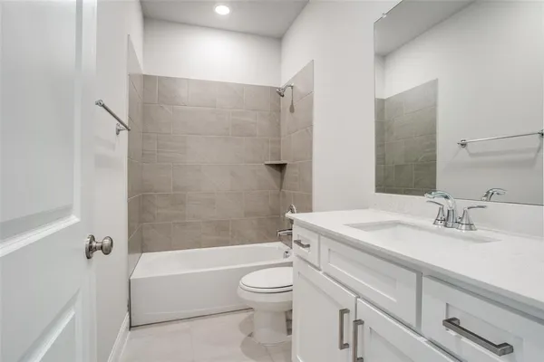 a bathroom with a sink a toilet and a bathtub