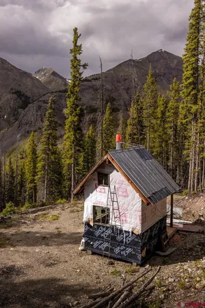 a aerial view of a house with a yard table and chair