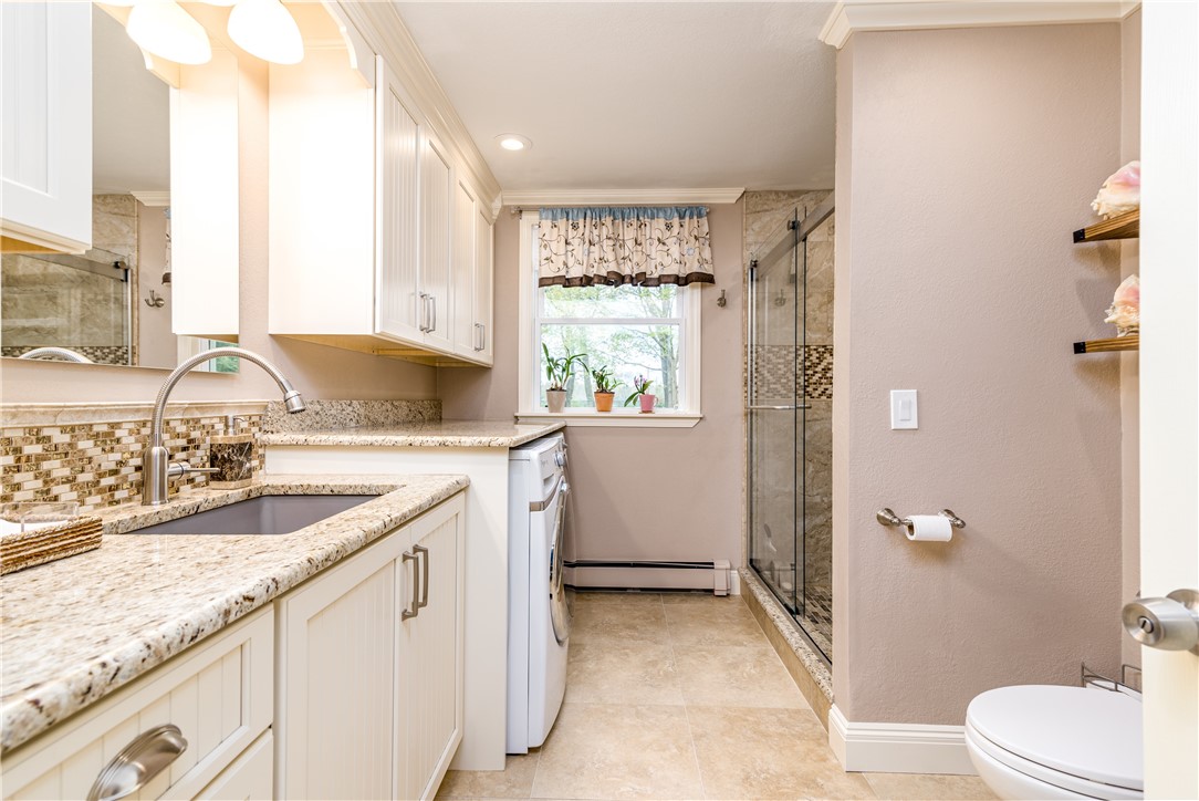 495 Waites Corner Road South Kingstown, RI 02892 - Photo 22 of 39 First floor laundry and full bath off garage.