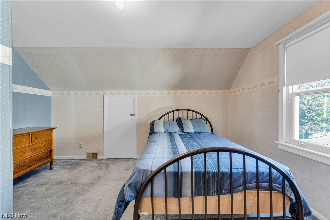 1195 Roland Road Cleveland, OH 44124 - Photo 25 of 34 Bedroom with lofted ceiling and light carpet