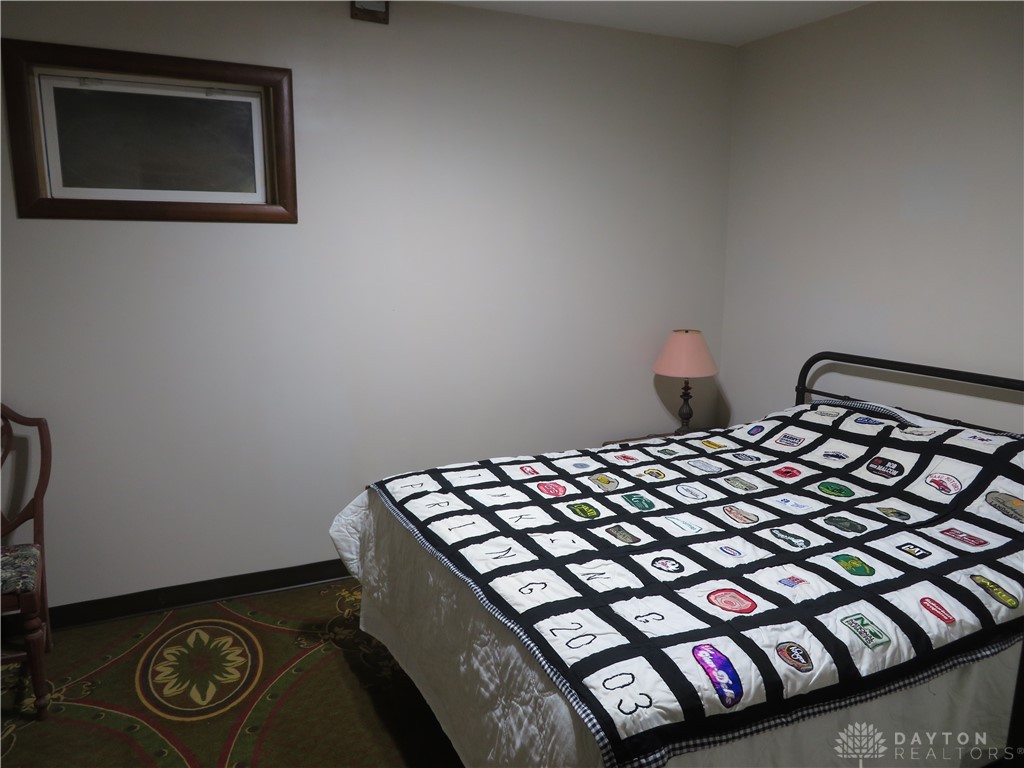 748 Inlow Avenue Peebles, OH 45660 - Photo 22 of 61 This cozy bedroom offers a tranquil retreat with warm finishes and ample natural light.