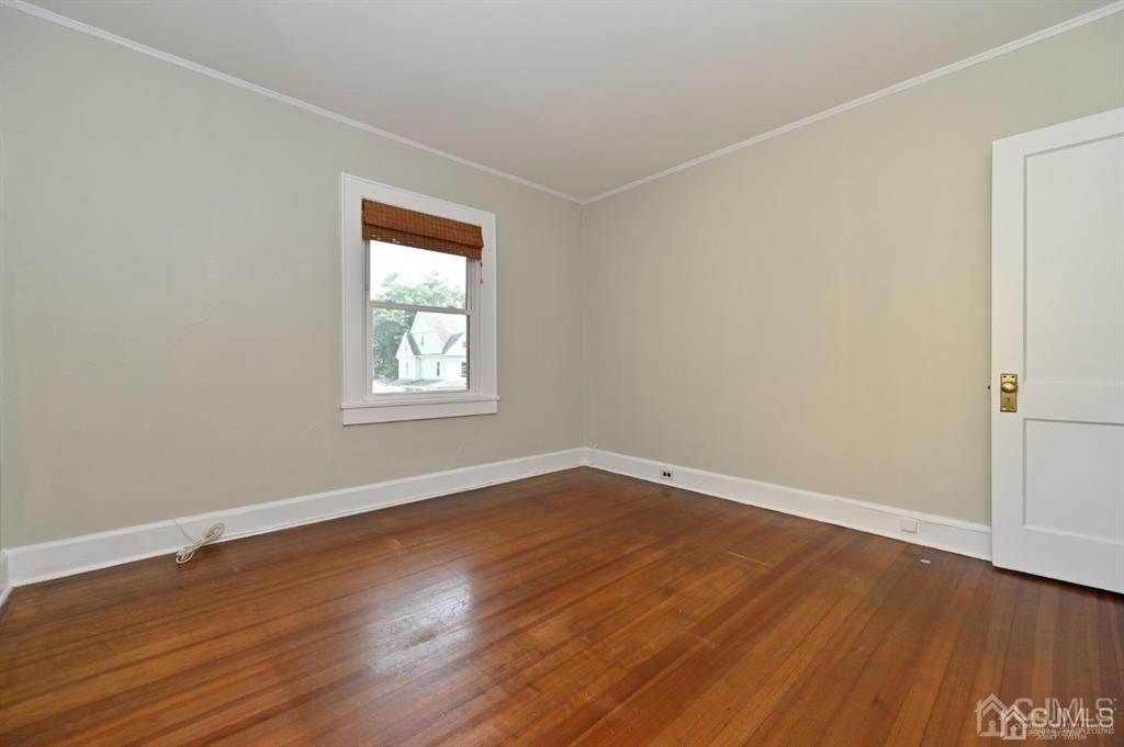 48 Christopher Street Montclair, NJ 07042 - Photo 12 of 23 an empty room with wooden floor and windows