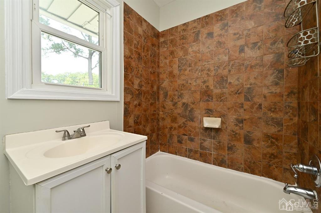48 Christopher Street Montclair, NJ 07042 - Photo 7 of 23 a bathroom with a sink and a bathtub