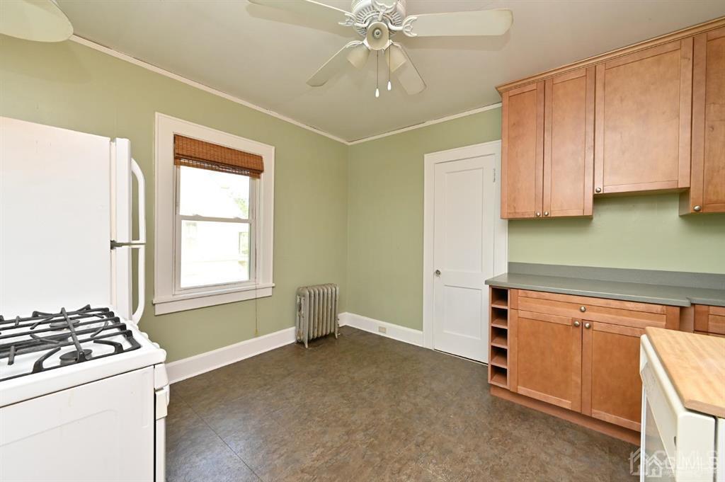 48 Christopher Street Montclair, NJ 07042 - Photo 9 of 23 a kitchen with a stove a sink and a refrigerator