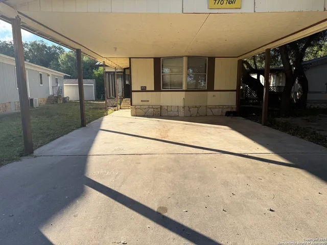a view of a house with a street