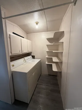 a utility room with washer and dryer