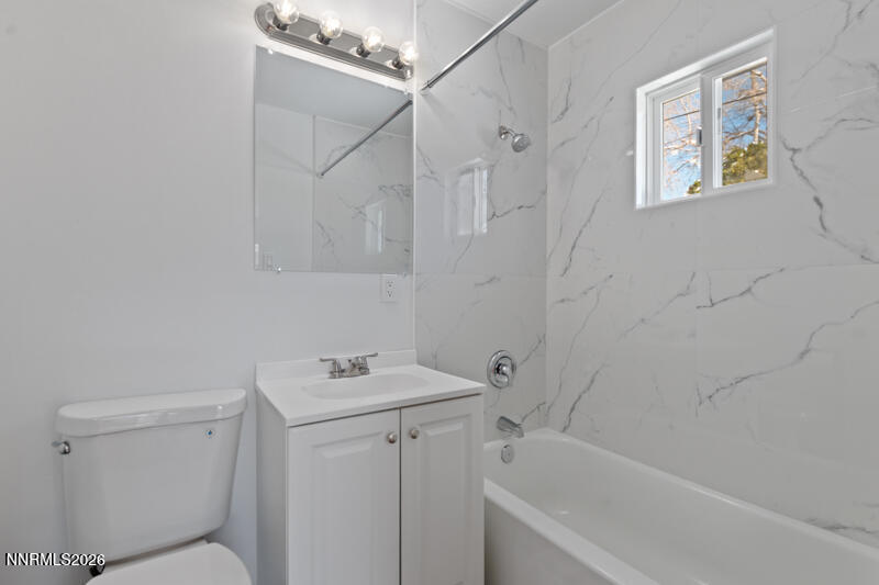 810 Lahontan Way Reno, NV 89509 - Photo 13 of 25 a bathroom with a sink a toilet and shower