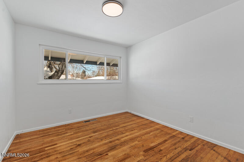 810 Lahontan Way Reno, NV 89509 - Photo 14 of 25 a view of empty room with wooden floor