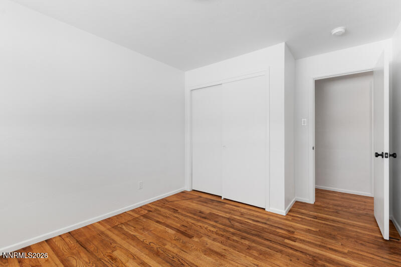 810 Lahontan Way Reno, NV 89509 - Photo 15 of 25 a view of empty room with wooden floor