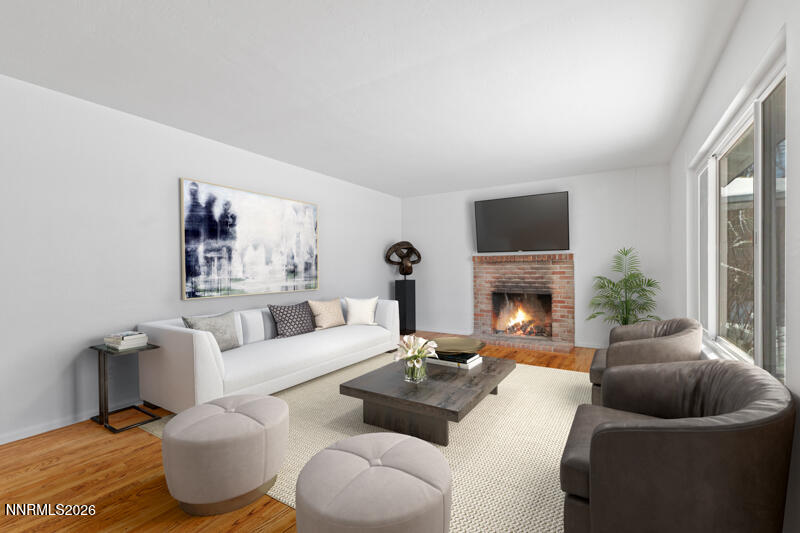 810 Lahontan Way Reno, NV 89509 - Photo 3 of 25 a living room with furniture and a fireplace