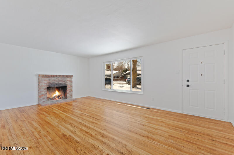 810 Lahontan Way Reno, NV 89509 - Photo 4 of 25 a view of an empty room with a window and fireplace